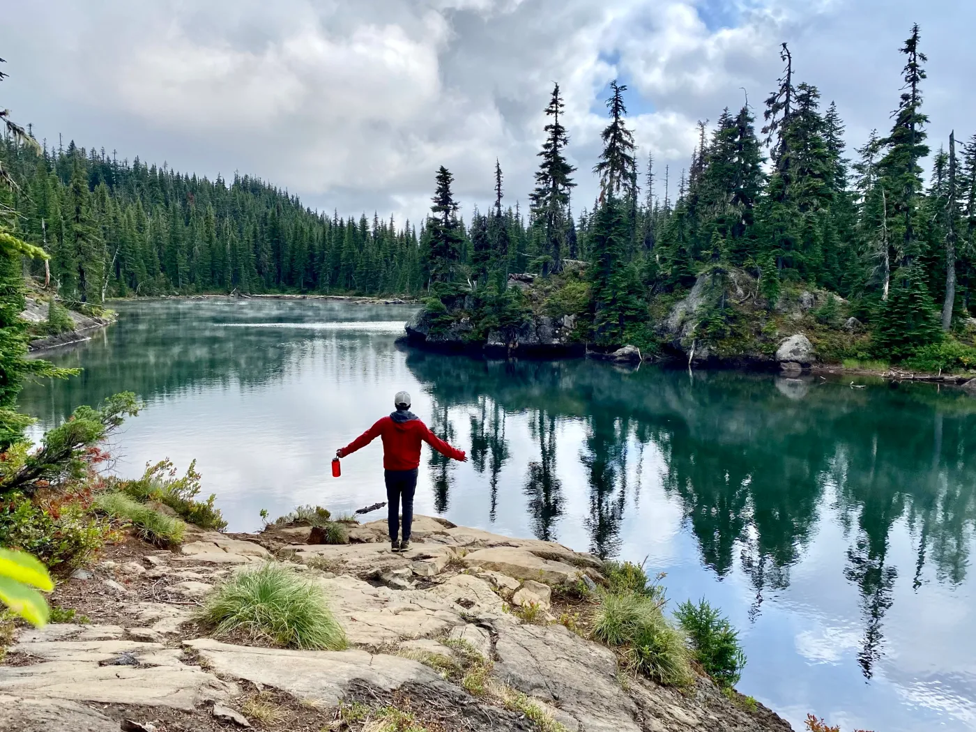 Hiker at an alpine lake in the Cascades near Bend